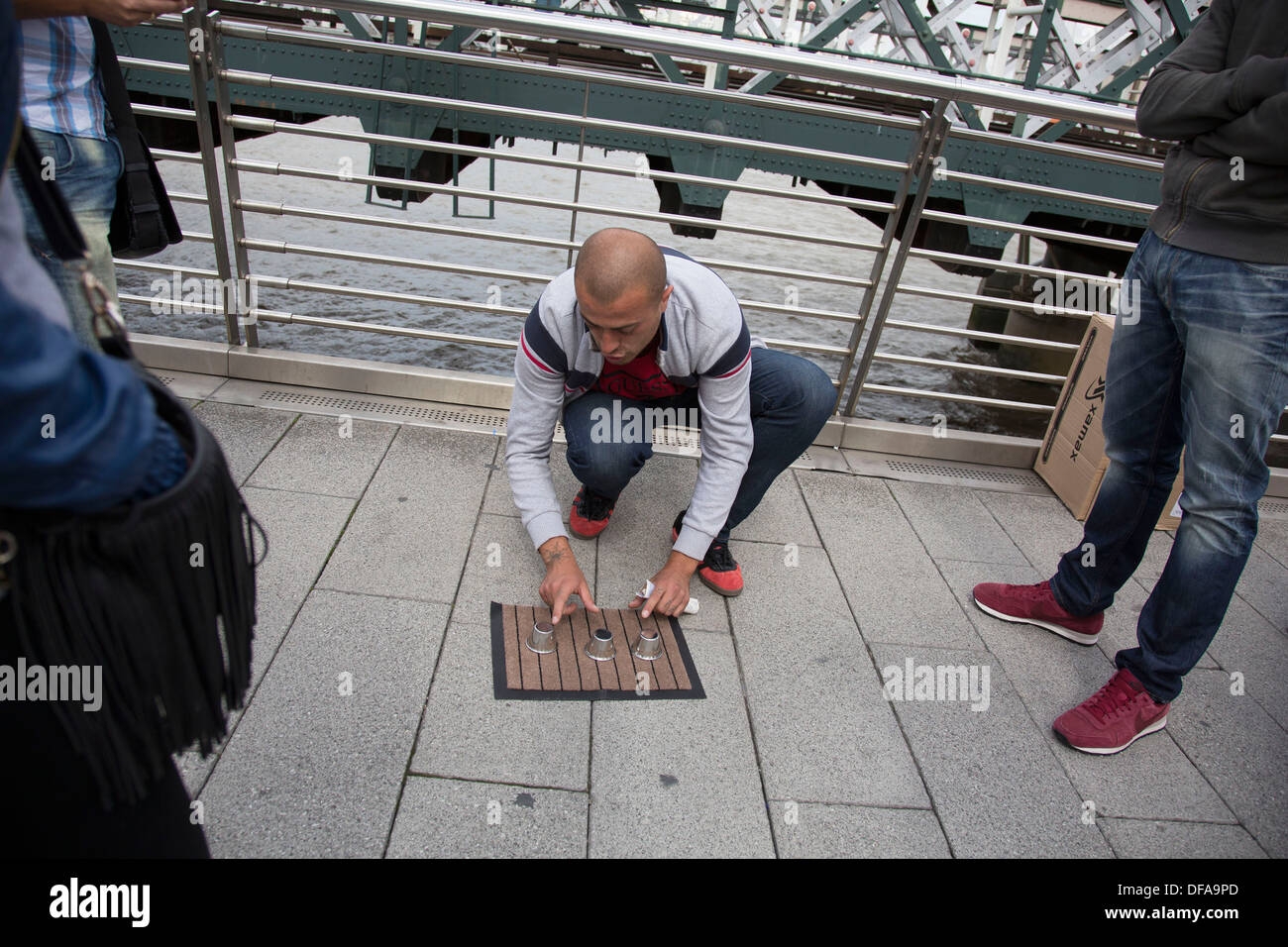Man Playing A Con Game For Passers By Three card Monte aka Find The Lady Or Three Card Trick Is A Confidence Game Stock Photo Alamy